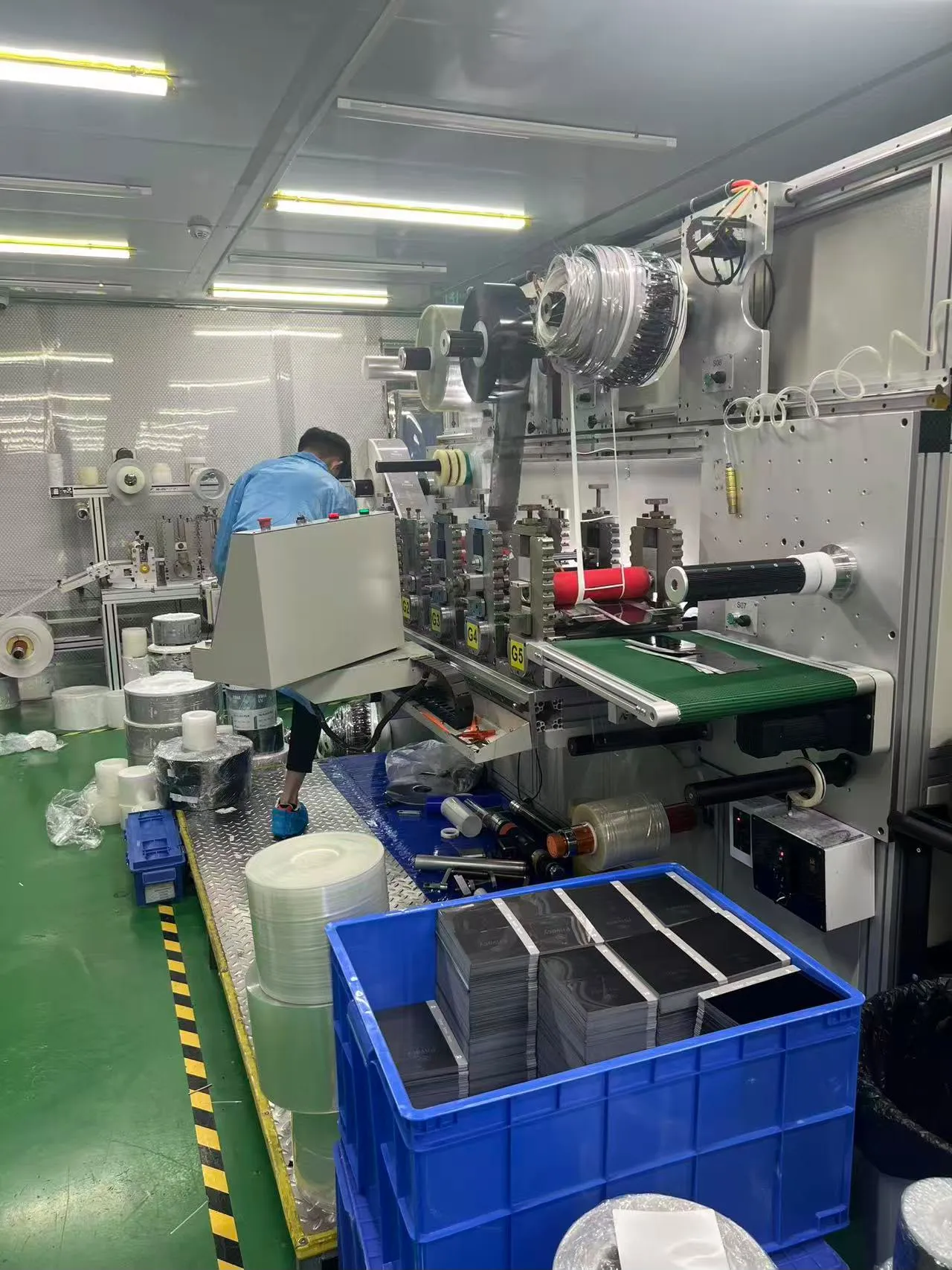 Factory work area with equipment and material bins